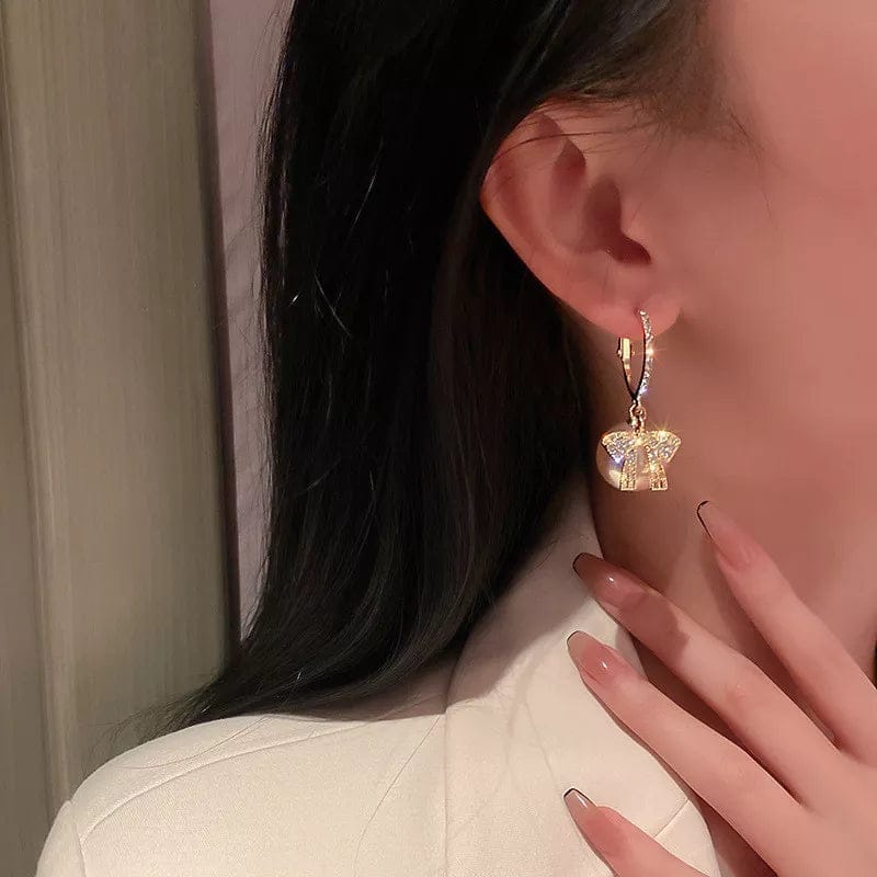 Pavoco Ohrringe Elegante Perlenohrringe für Damen festlich mit Schleifen und hochwertigem Metall